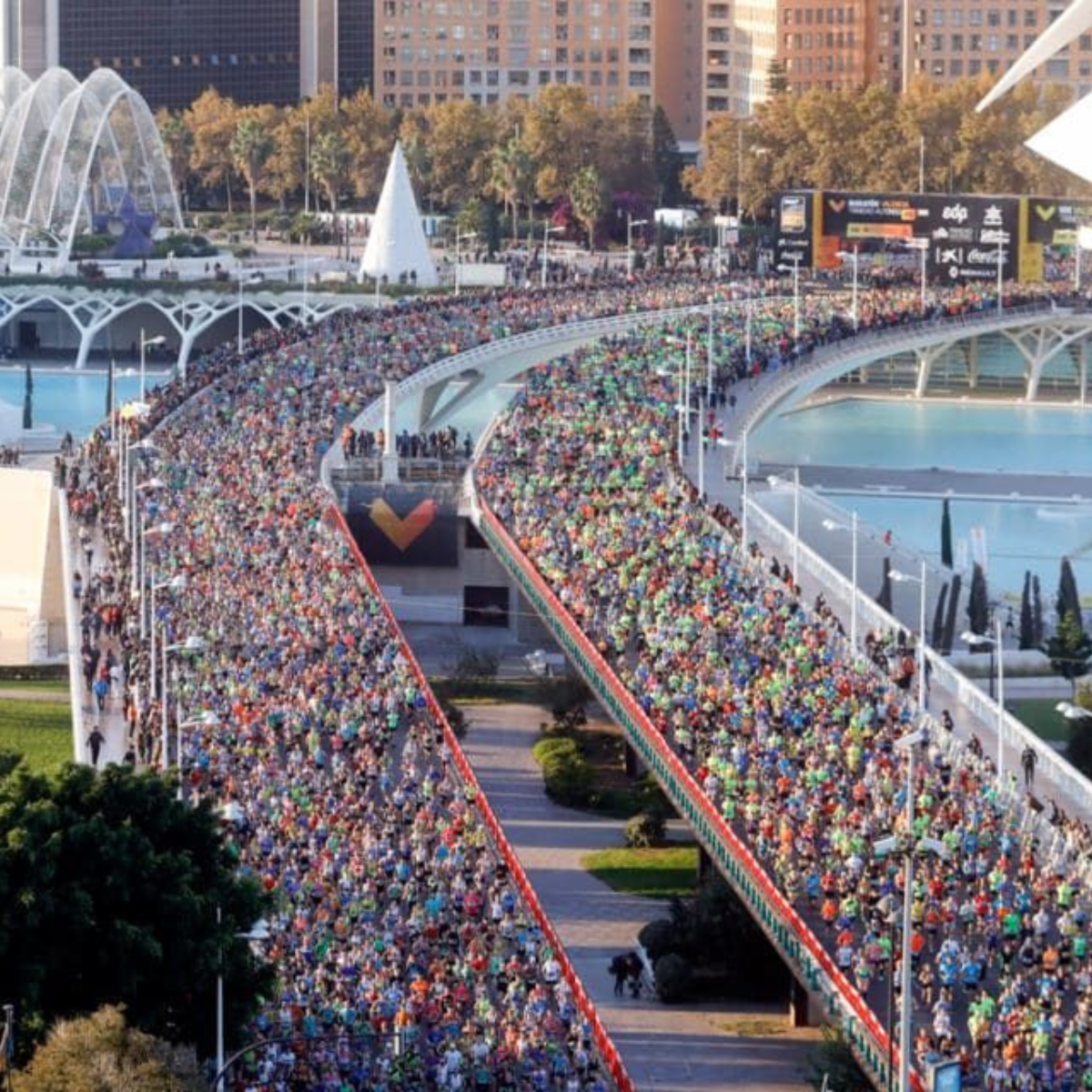 Runners over a bridge in Valencia