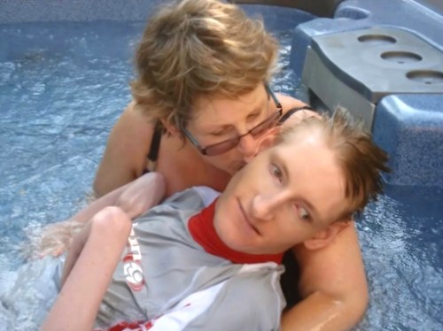 Photo of two people in a hydro pool