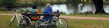 two people outdoors with bikes